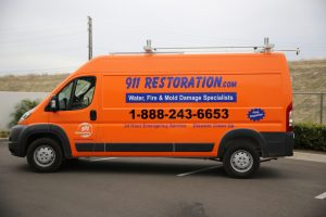 911-restoration-water-damage-mold-remediation-fire-damage-person-van-wideangle
